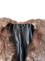 Close-up of fur, leather at neck.