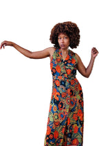 Woman wearing a colorful floral dress .