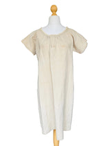 Beige dress on a mannequin.
